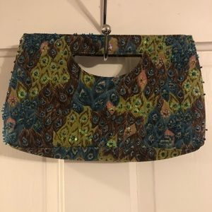 Beaded peacock design clutch purse with two snaps for closure from The Limited